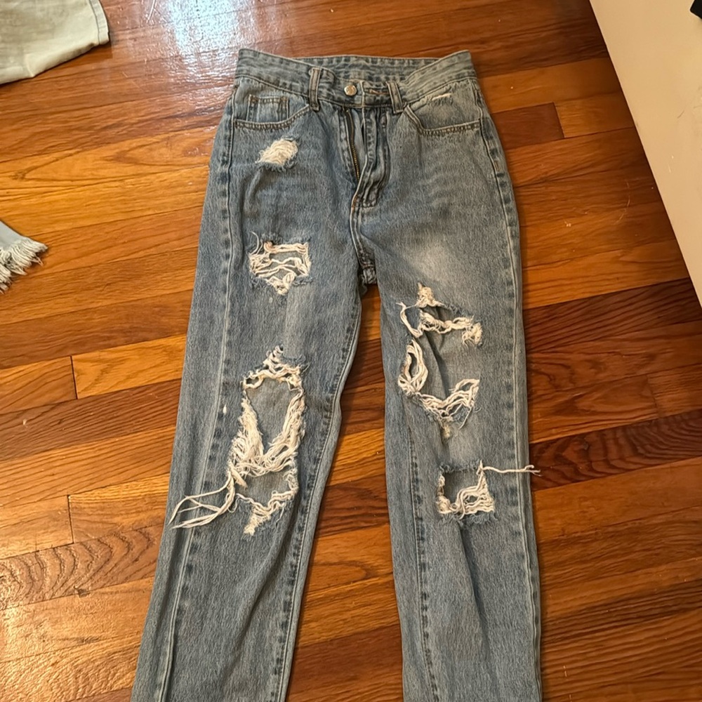 Two pairs of jeans, both size small ripped jeans, light, and dark wash